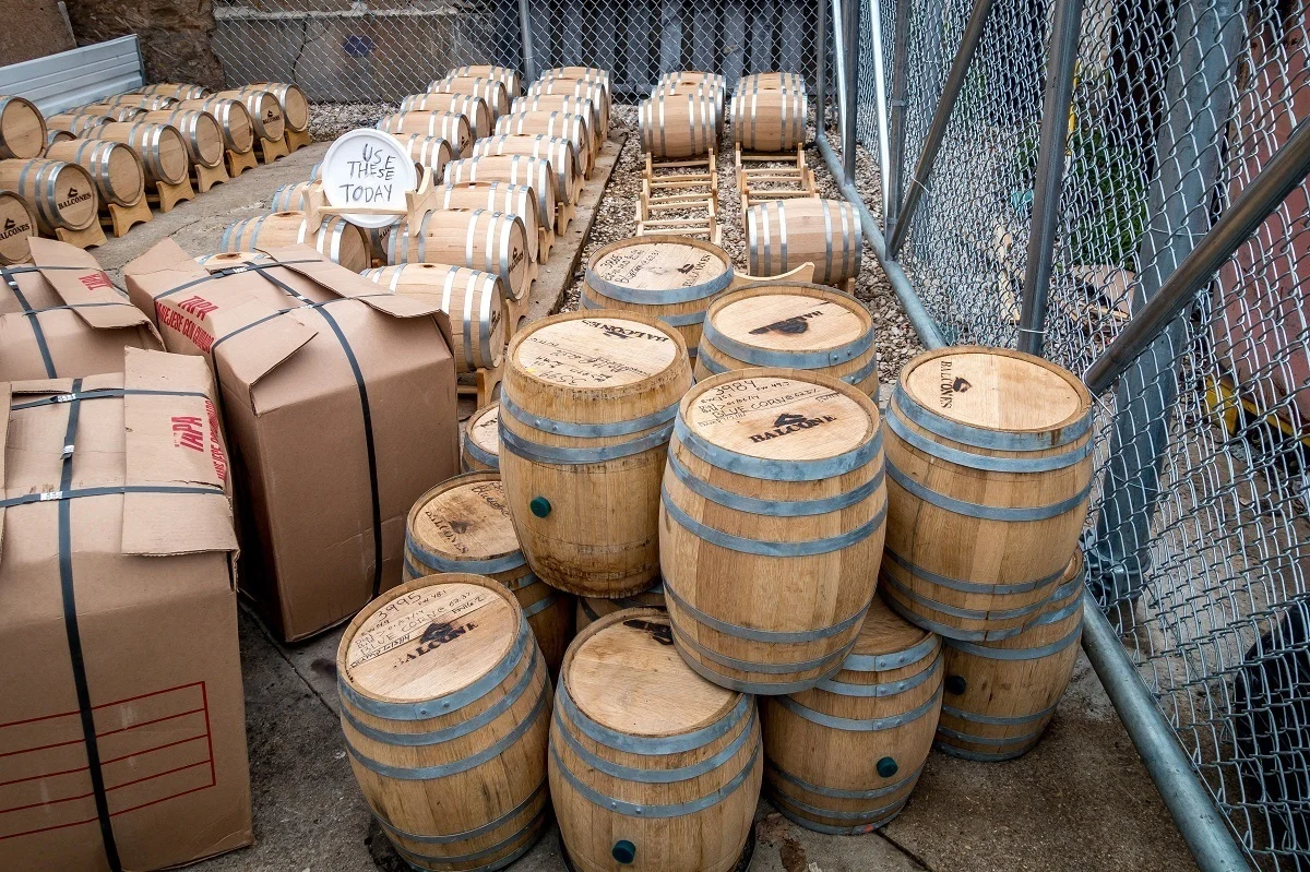 Five-gallon whiskey barrels outside 