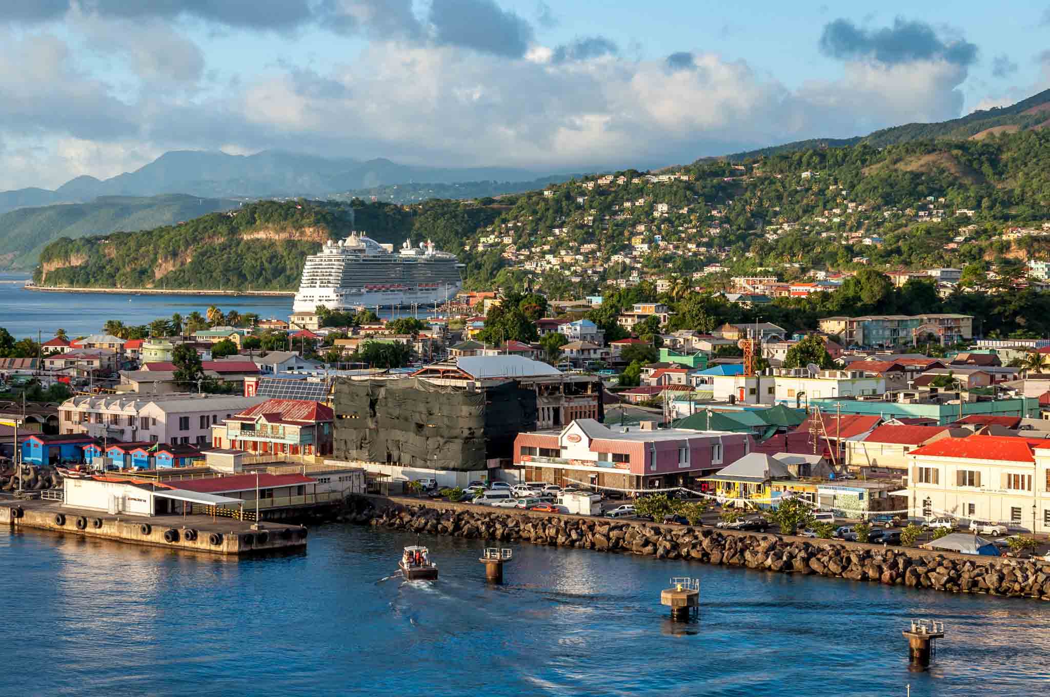 Cruise ship in the port of Roseau, Dominica with hills in the background