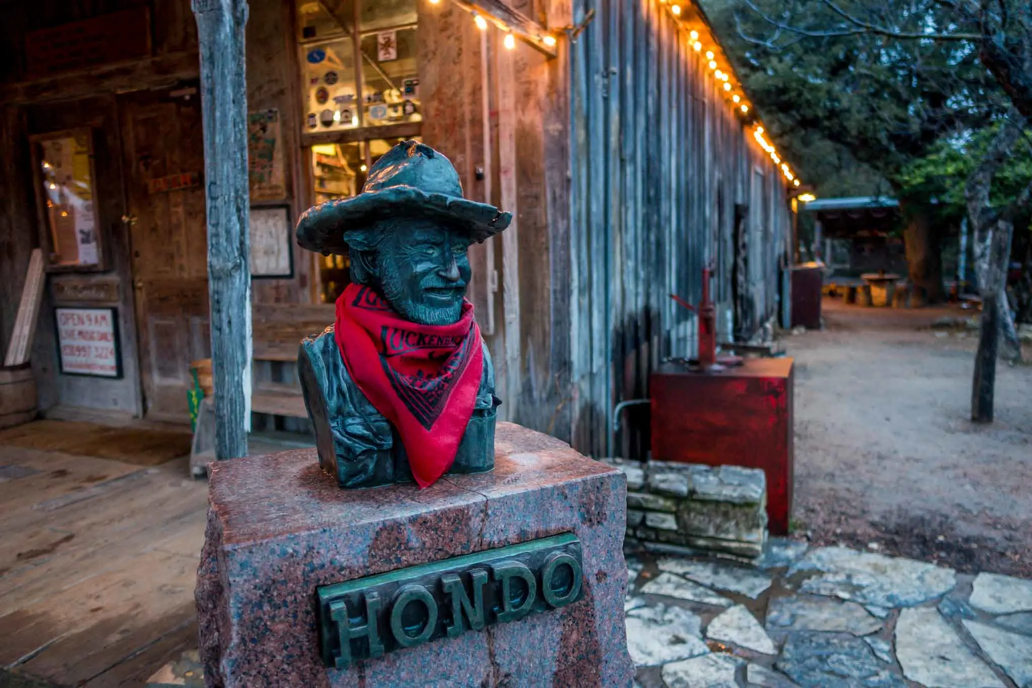 Small bust of Hondo Crouch wearing bandana