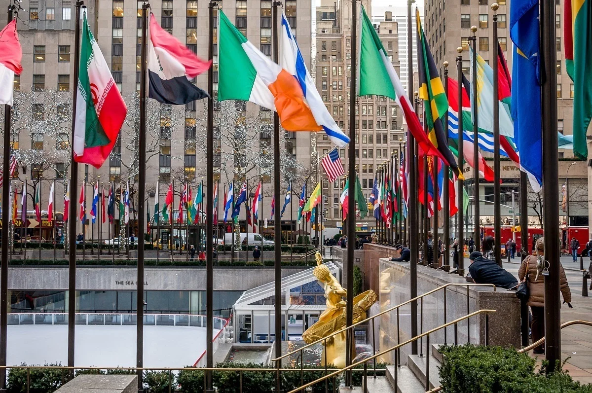 Rockefeller Center Plaza surrounded by flags in New York