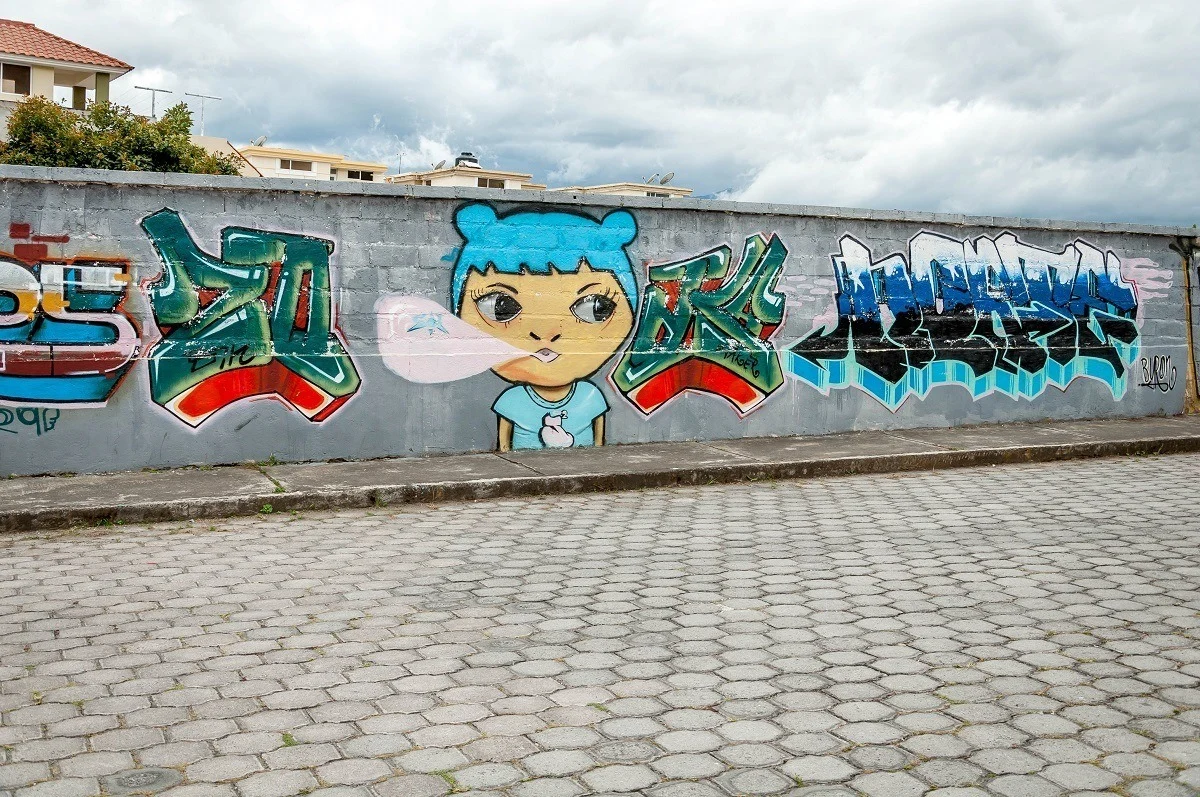 Graffiti mural of girl in Cotacachi