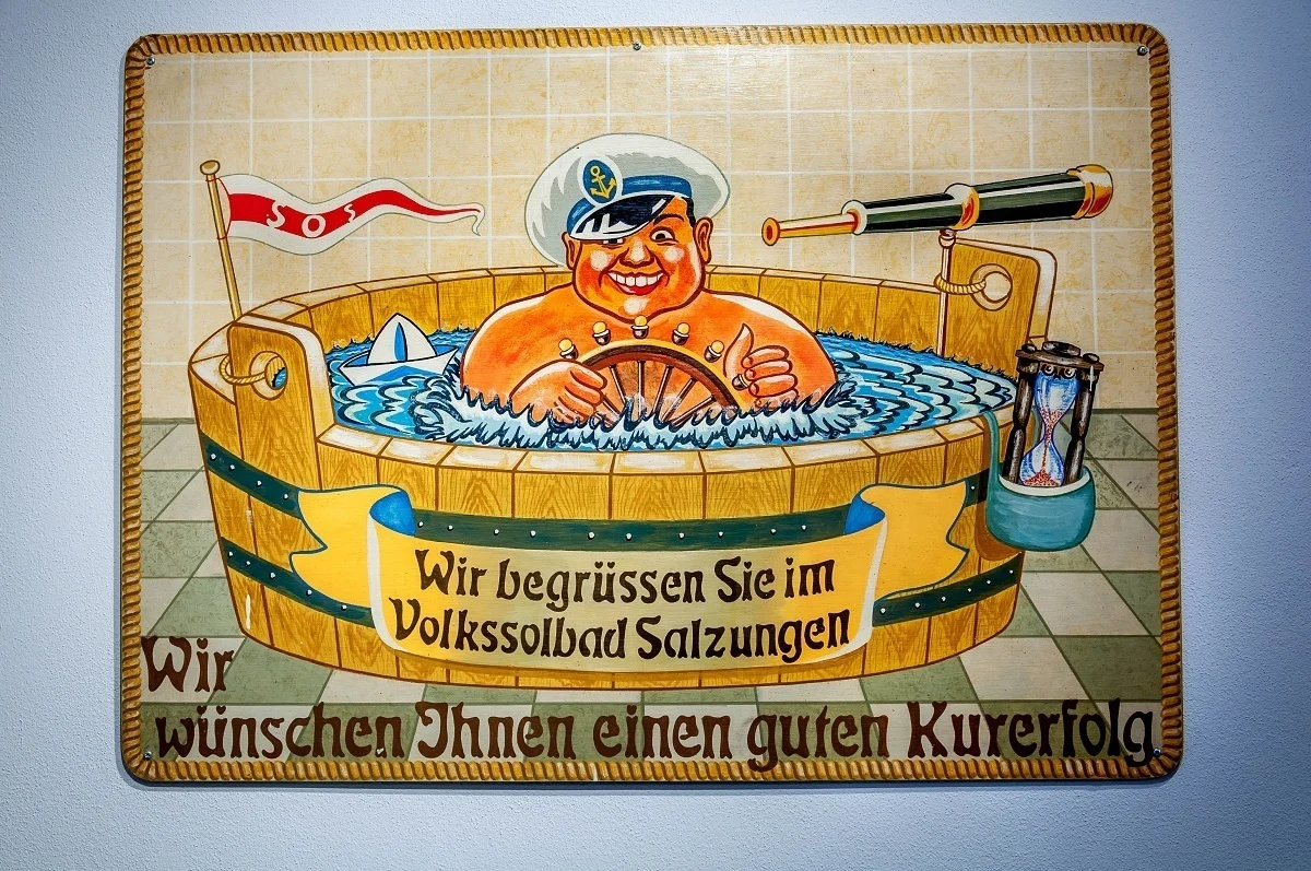 Vintage advertisement of a man in a bath