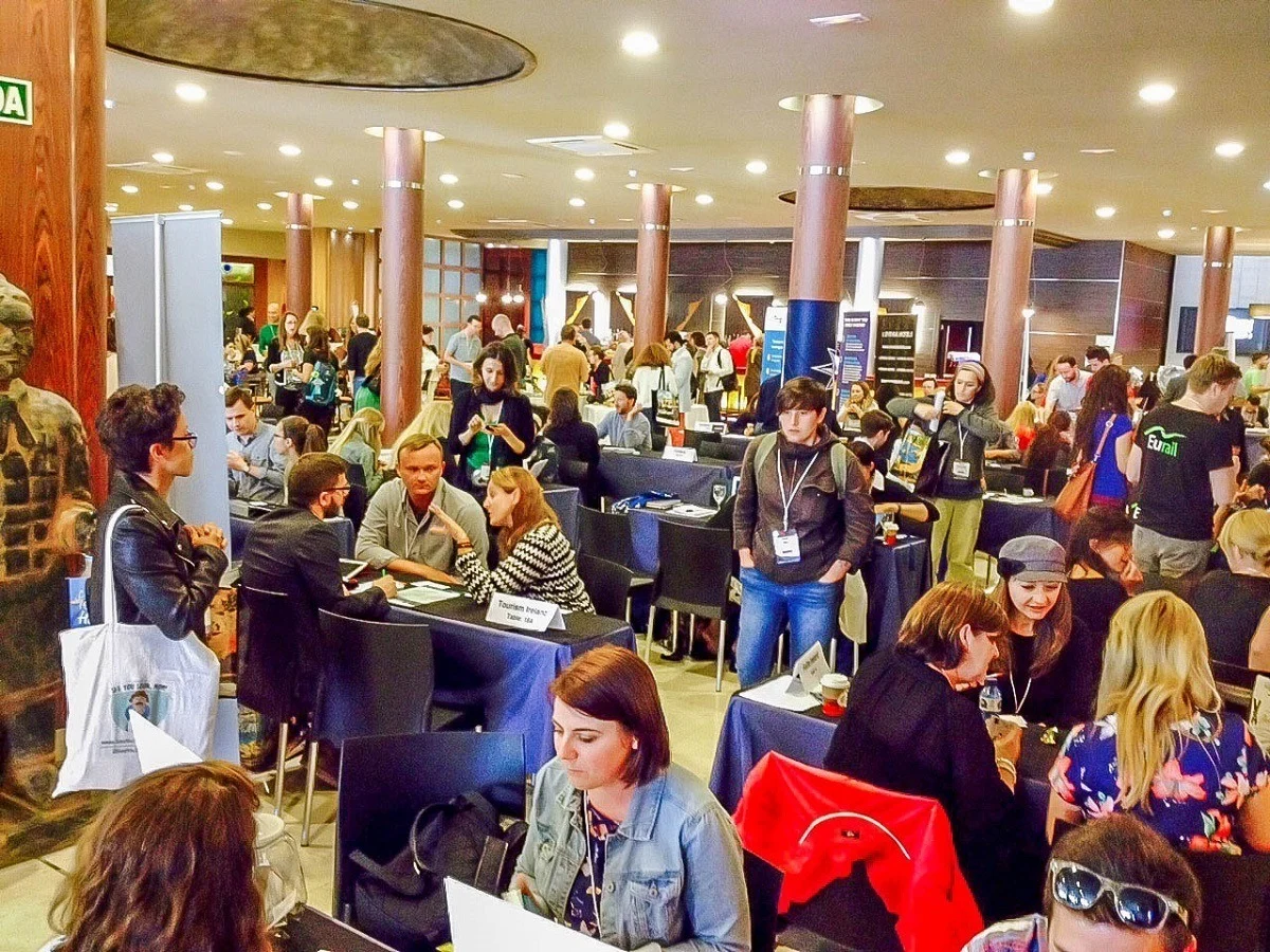 Tables of people networking at TBEX Europe