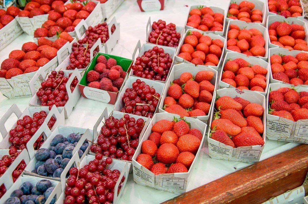 Fruit and berries in cartons on a table