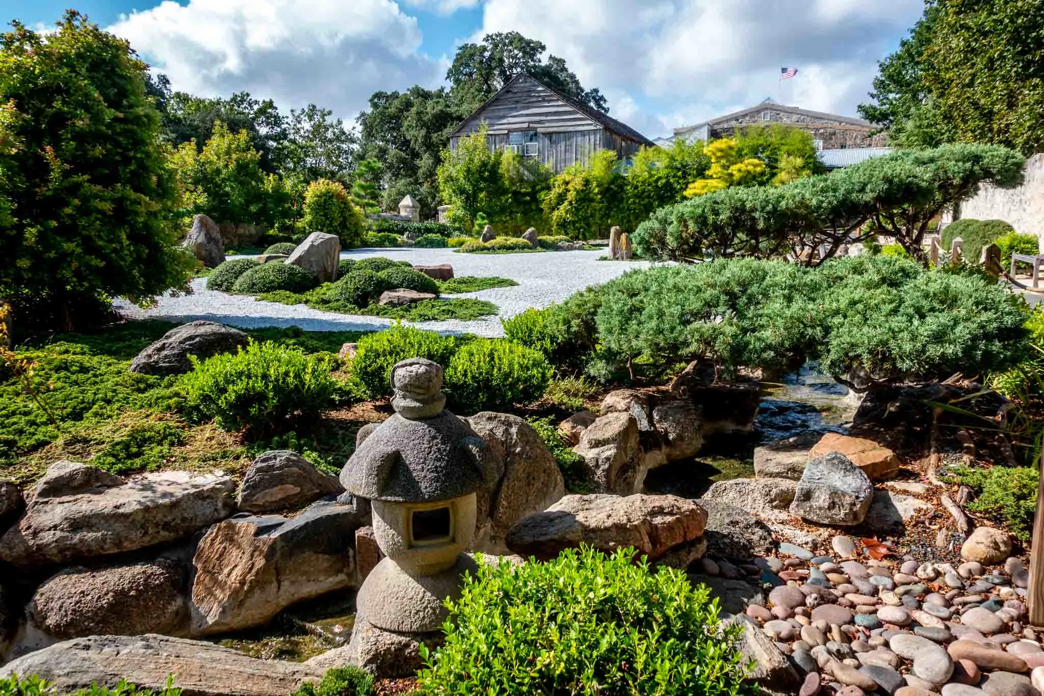 Plants, rocks, and decorations in a Japanese-style garden 