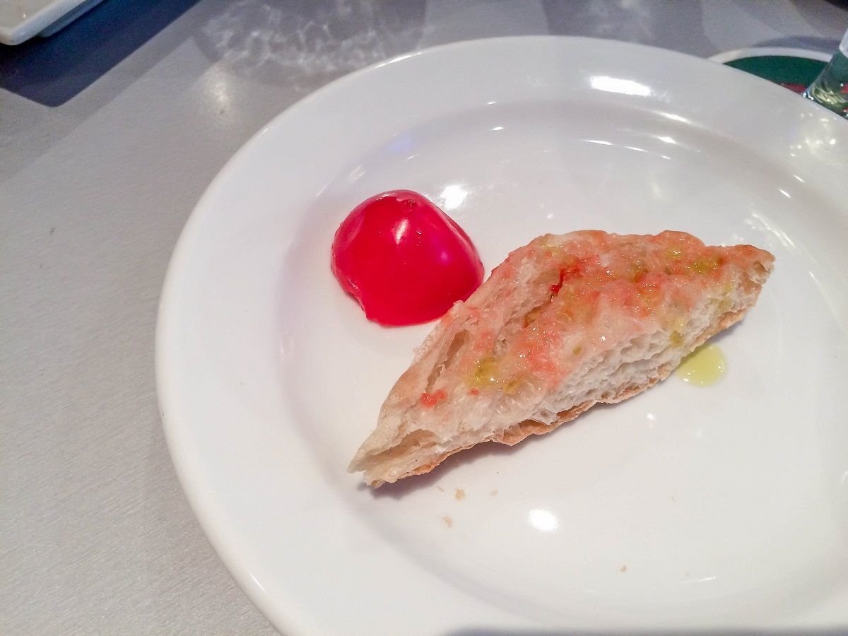 Making Pa amb tomaquet (Pan Tomat) on a Devour Barcelona food tour