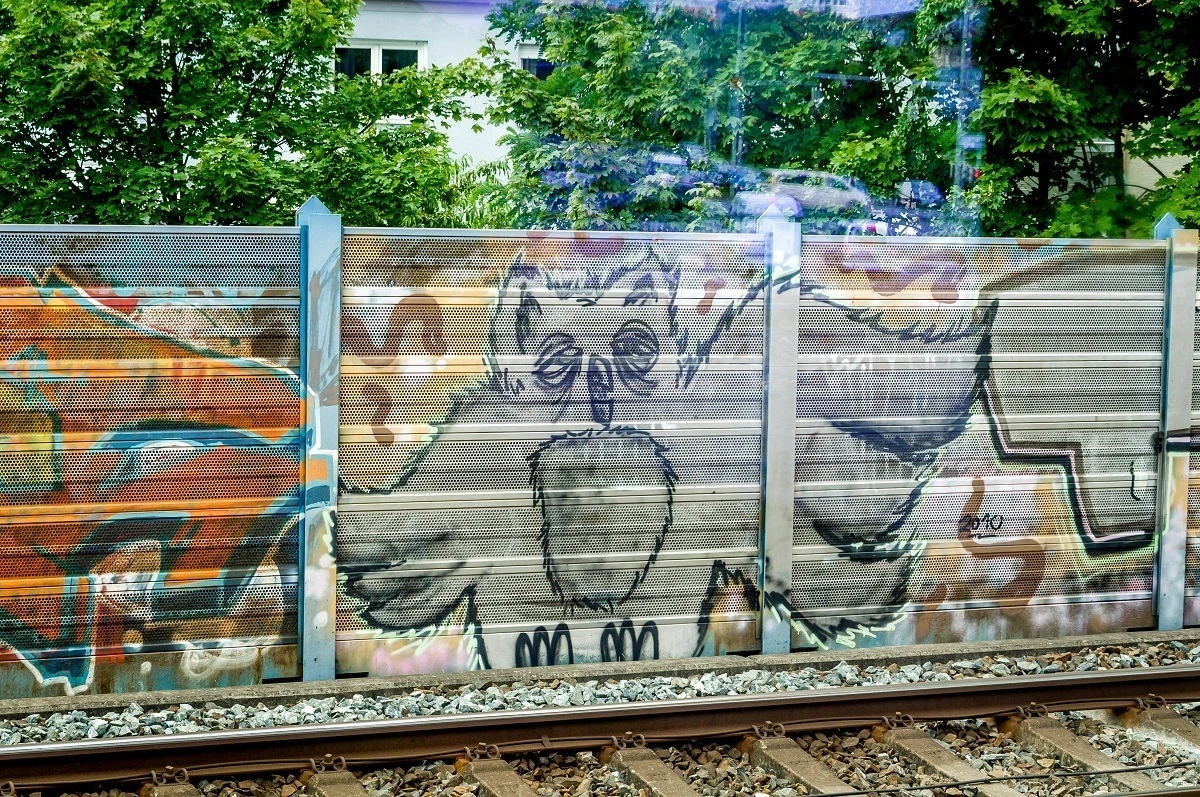 Nuremberg street art of an owl by the railway tracks