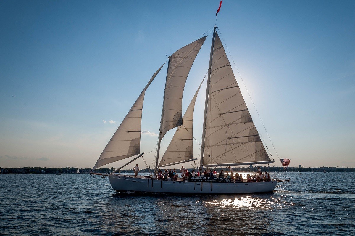 Schooner with many passengers sailing on water