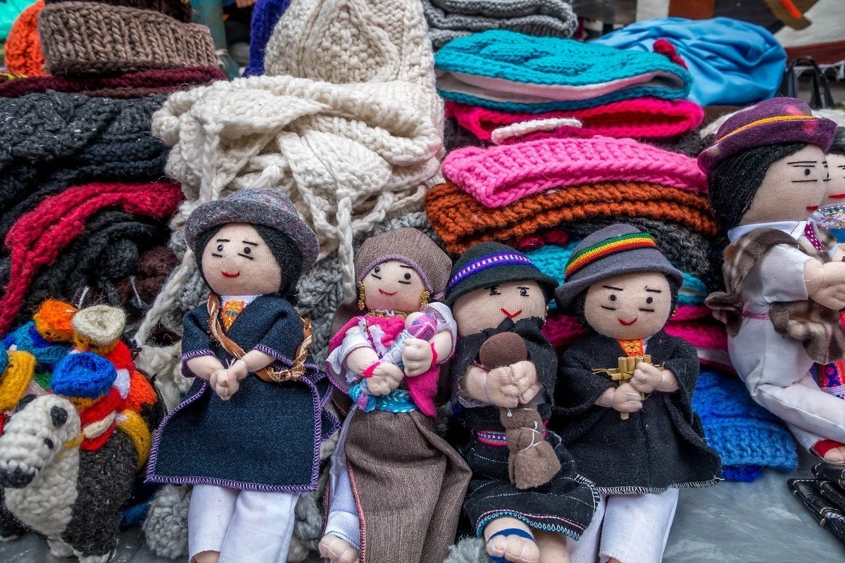 Souvenirs like wool knit hats and dolls are available