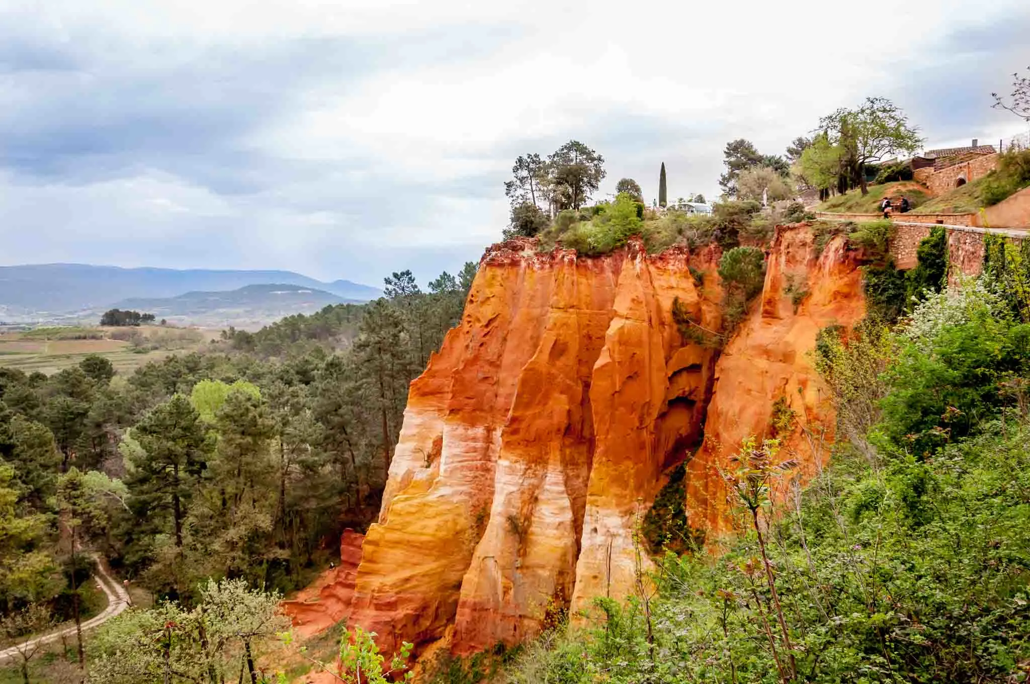 Red, yellow, and umber cliff full of ochre deposits