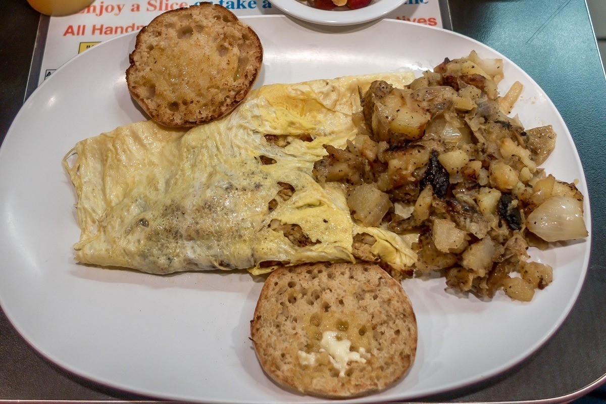 Crab and cheese omelet with potatoes and English muffin