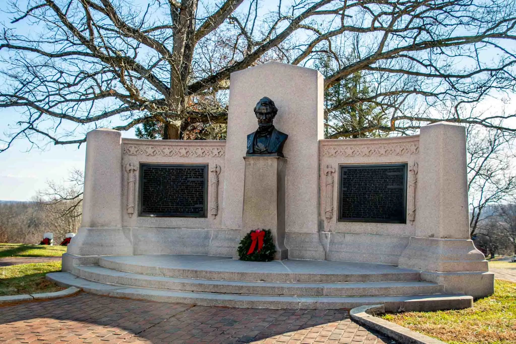 Stone memorial with bust of Abraham Lincoln.