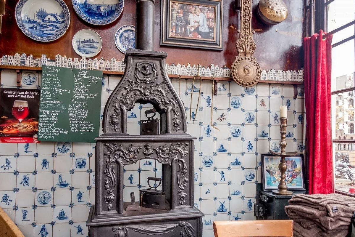 Menu and old-fashioned stove inside one of Amsterdam's brown cafes