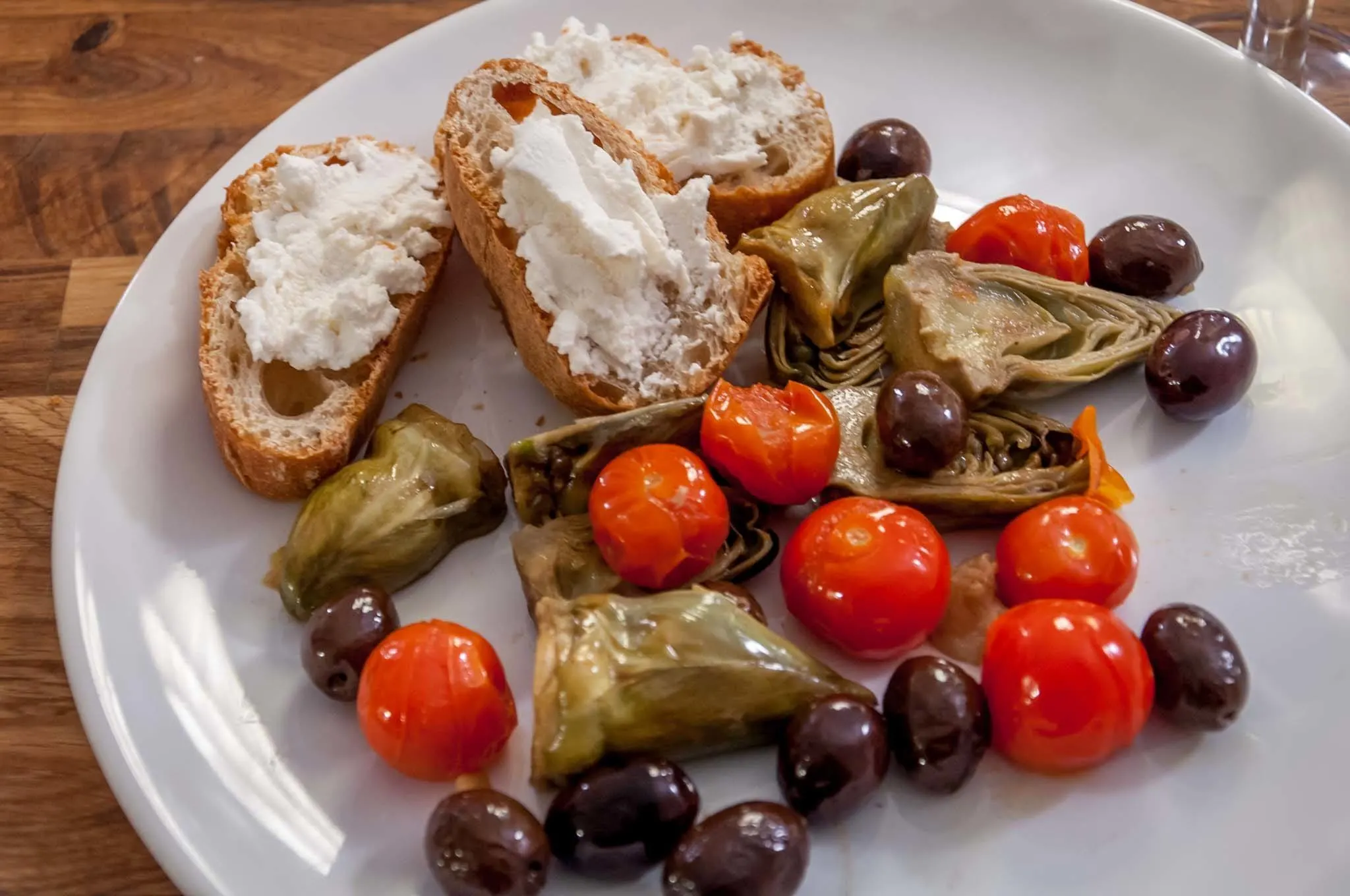 Artichokes, olives, tomatoes, and French bread