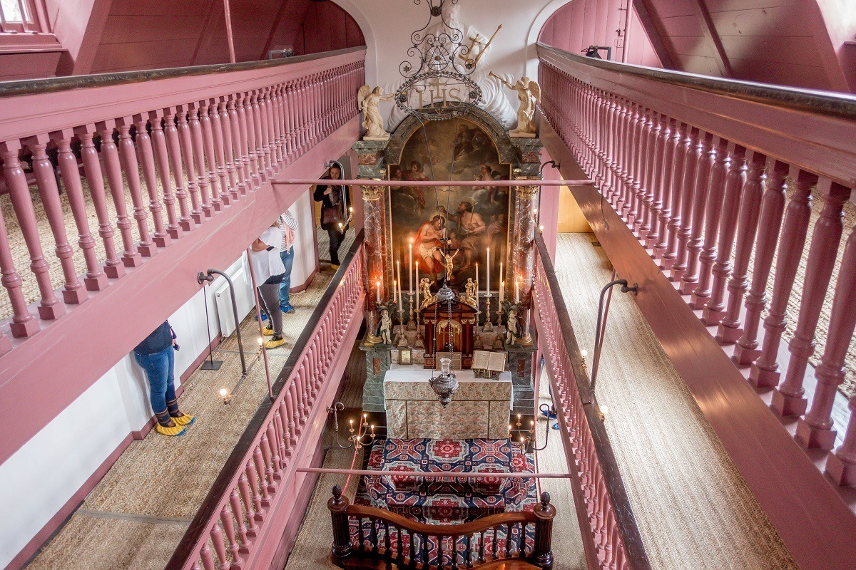 Pink railings above the altar at Our Lord in the Attic, a clandestine church in Amsterdam