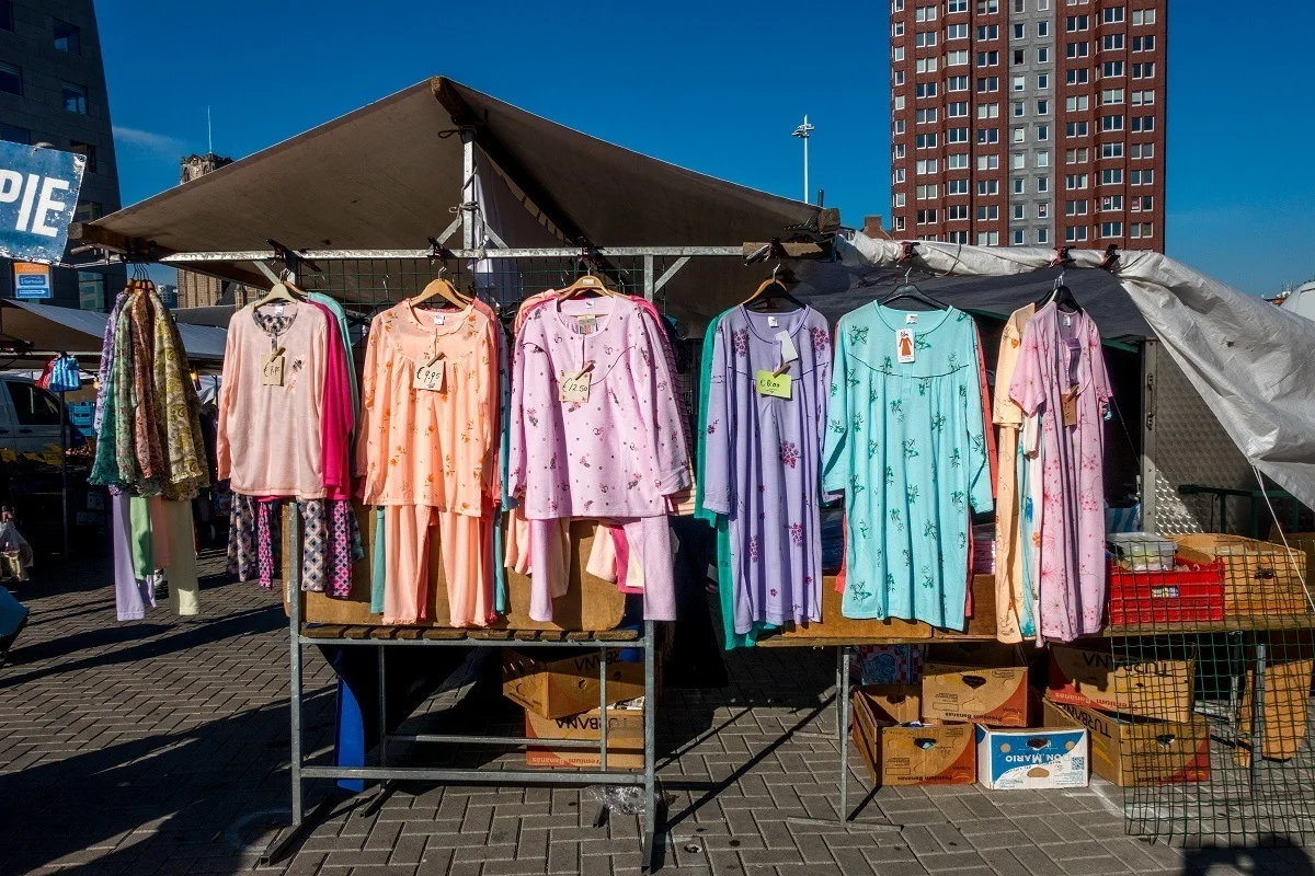 Clothes for sale at an outdoor market.