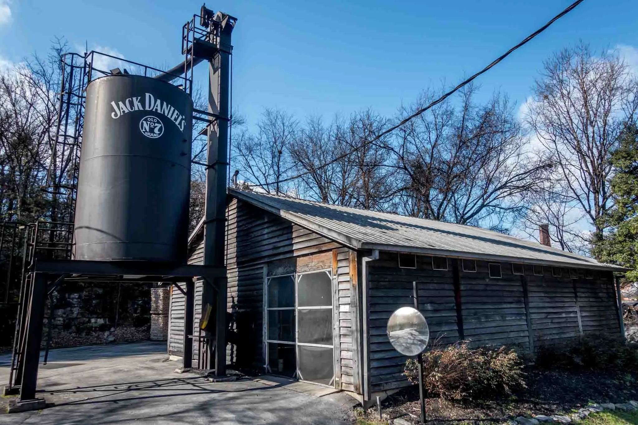 Building with water tower saying Jack Daniels at the distillery