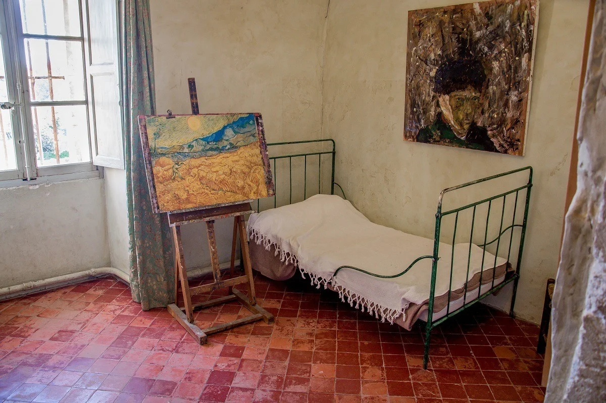 Bed and paintings in Van Gogh's room.