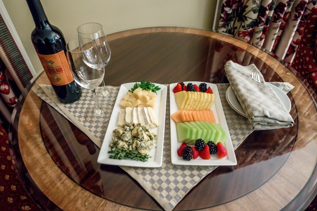 An in-room welcome gift of wine, cheese and fruit