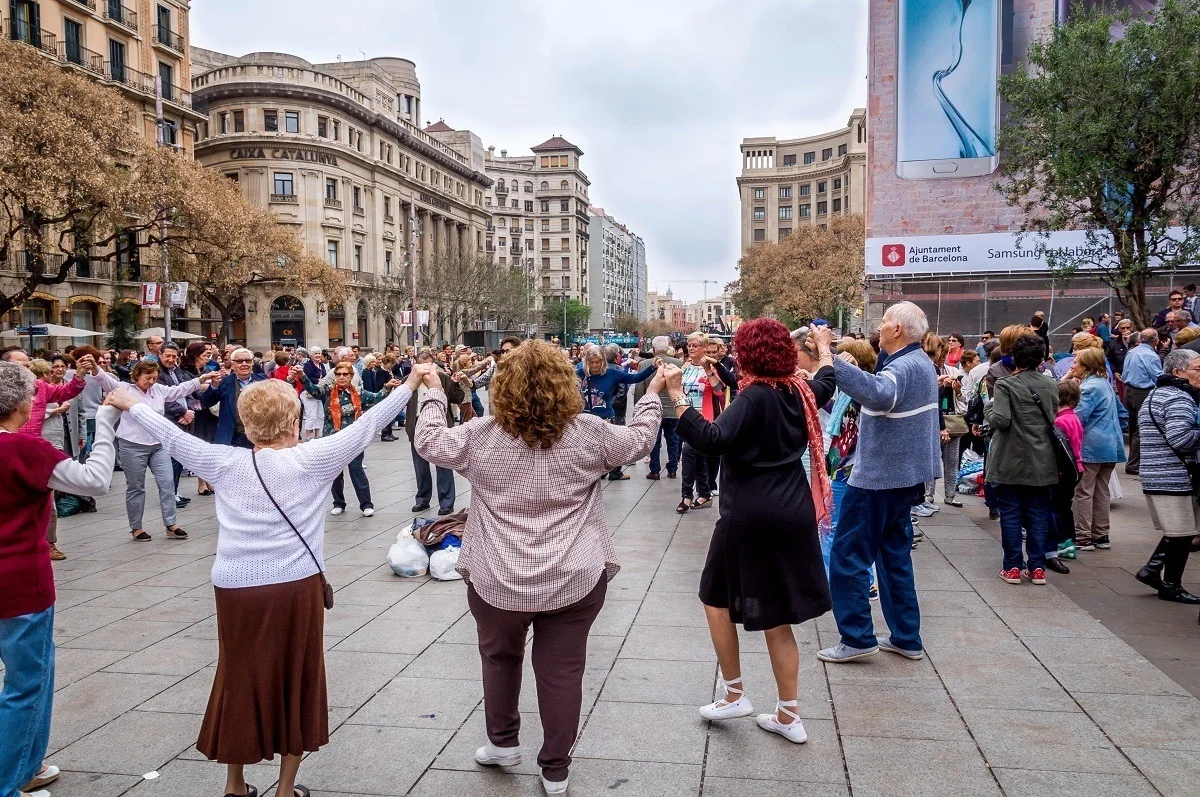 People dancing the Sardana in front of the Barcelona Cathedral in Spain