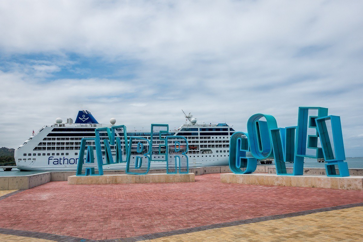 Amber Cove sign in front of cruise ship