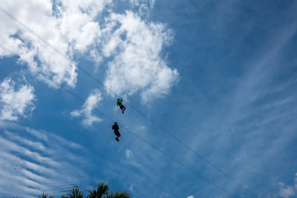 People zip lining 