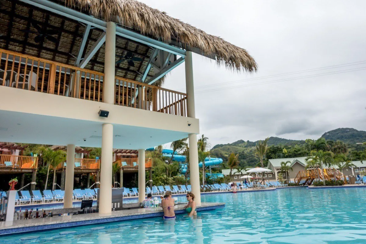 People at the Coco Cana swim-up bar in the pool