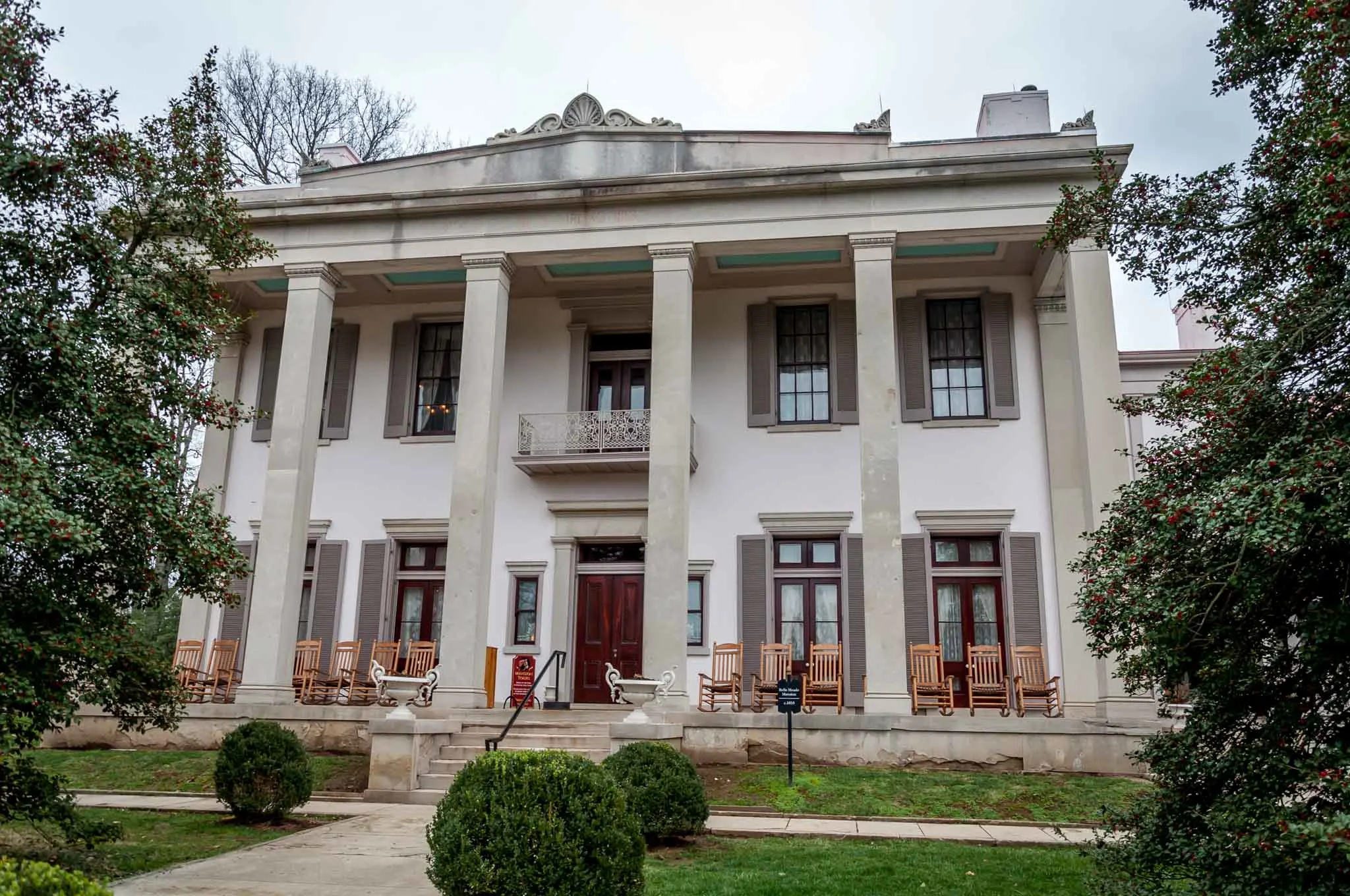 Large white house with columns.