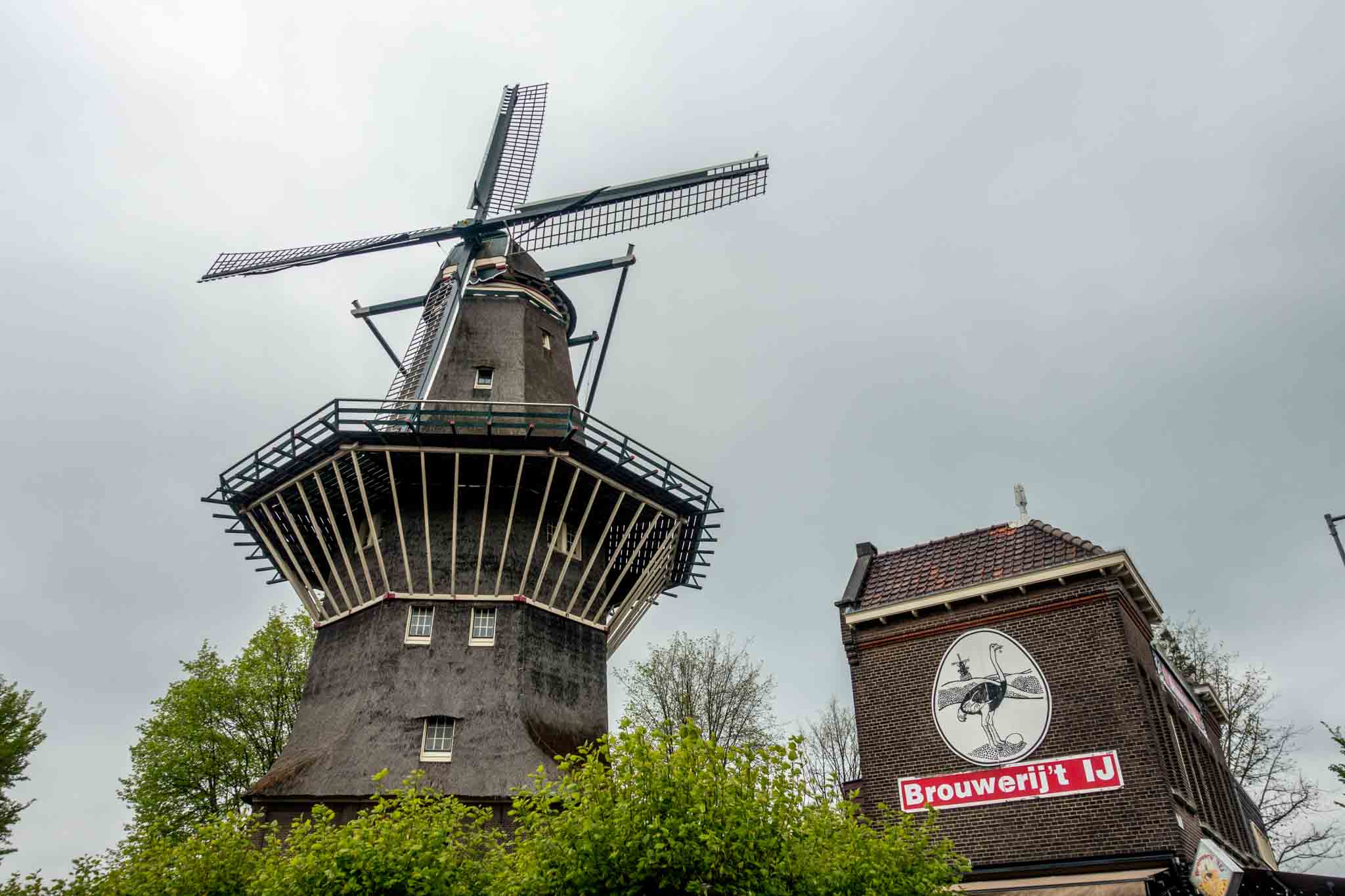 Windmill next to sign for Brouwerij 't IJ.