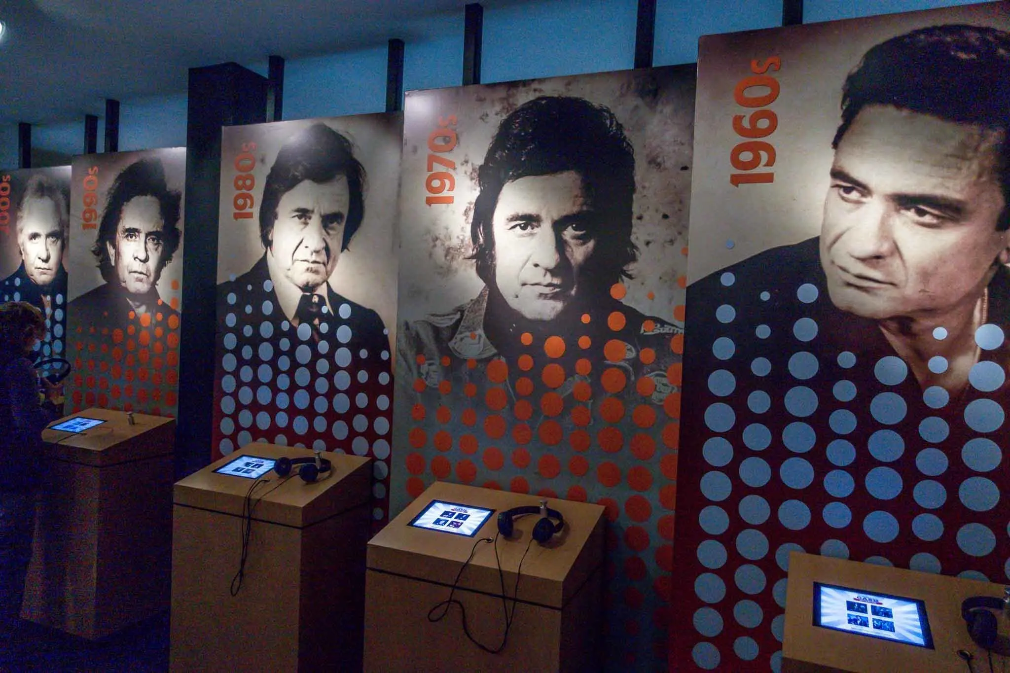 Interactive museum exhibits with photos of Johnny Cash.
