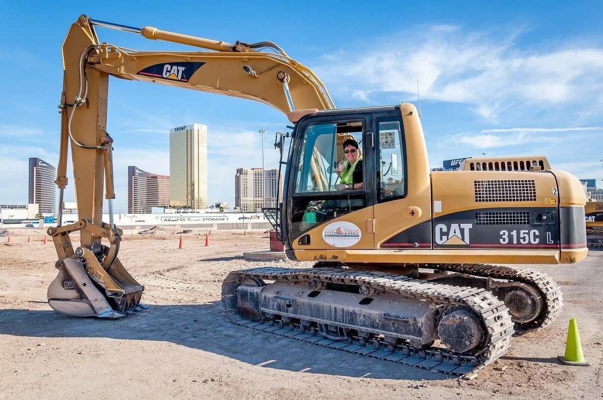 Lance driving an excavator in a diesel-fueled rush at Dig This in Las Vegas