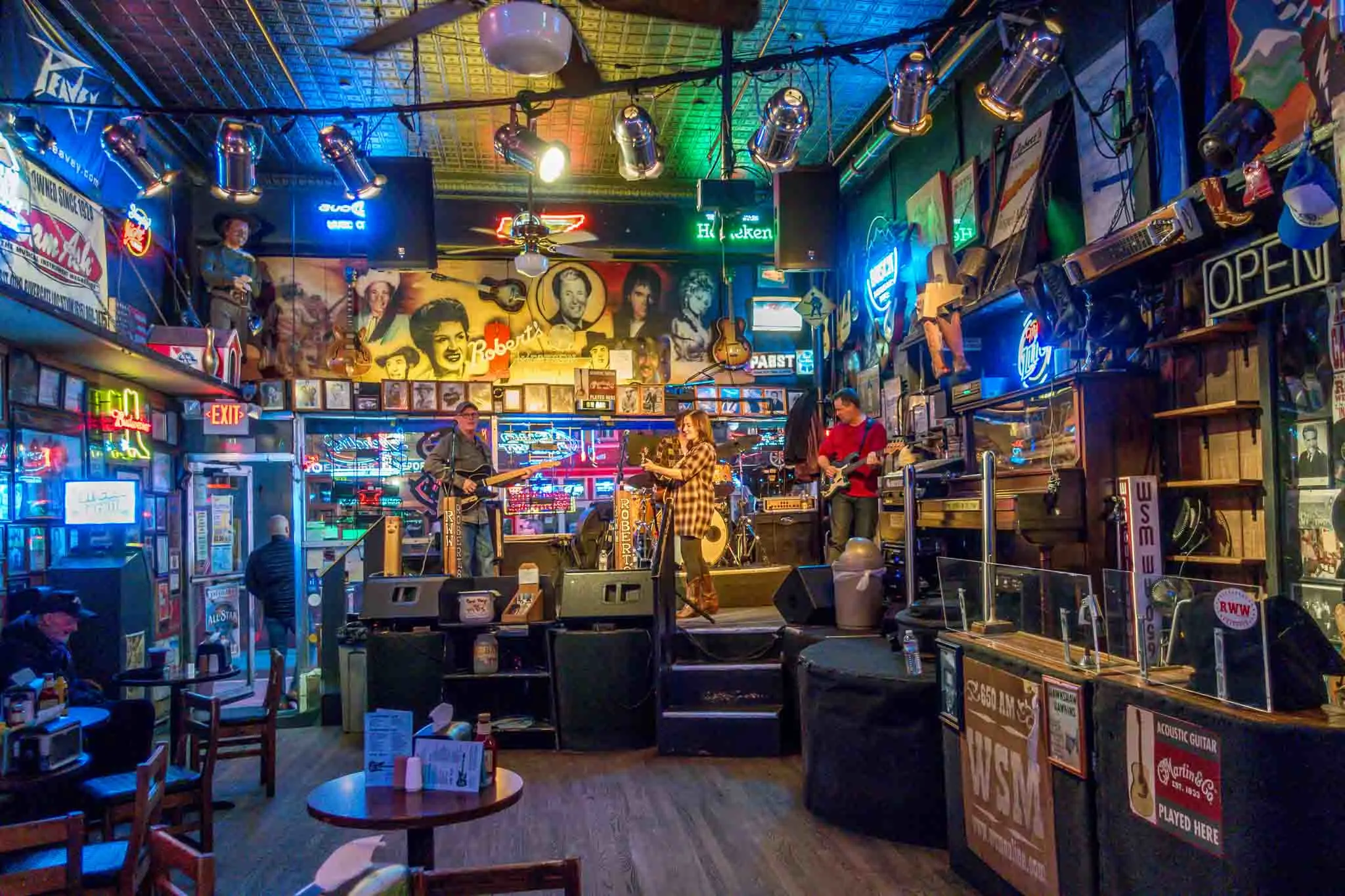 Band on stage at a memorabilia-filled honky tonk. 