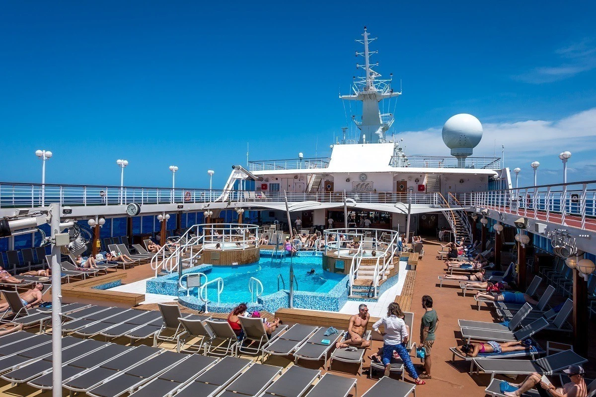 The Lido deck and pool on Fathom's Adonia cruise ship