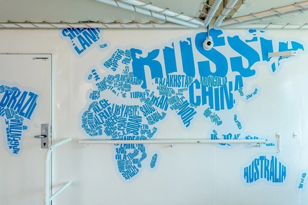 Map on a wall where words take the shape of countries