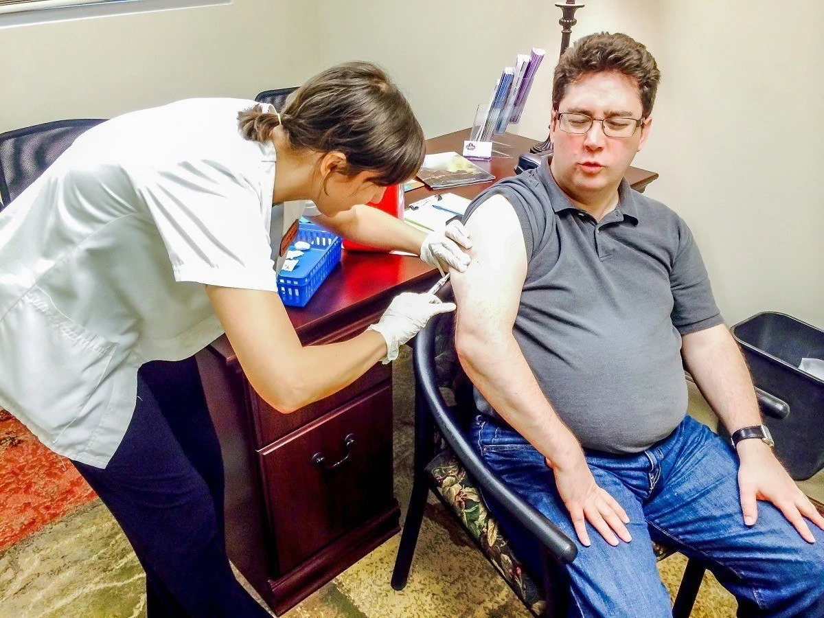 Man getting immunizations