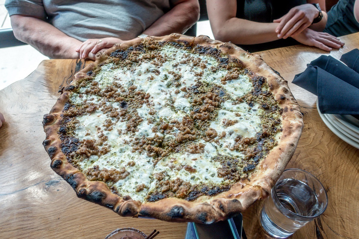 Pizza topped with pistachio pesto 