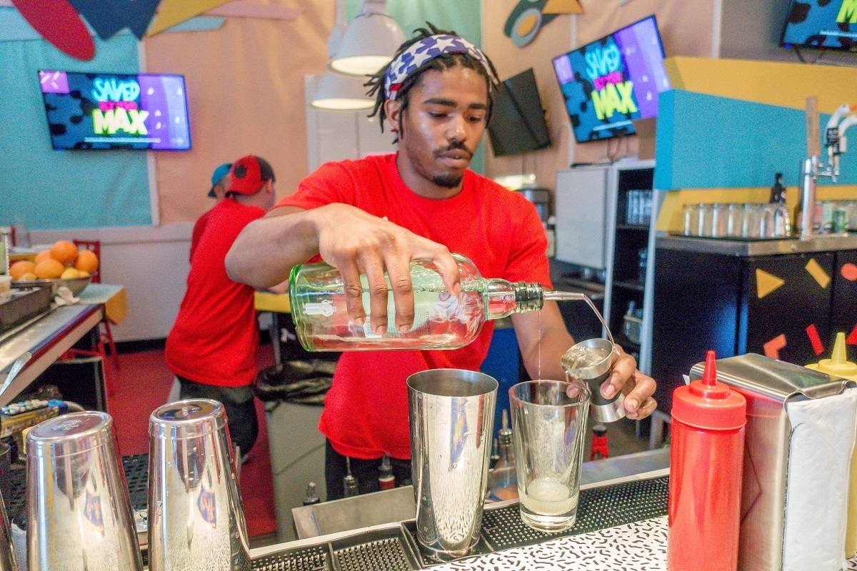 Bartender making drinks with names inspired by the cast of Saved by the Bell