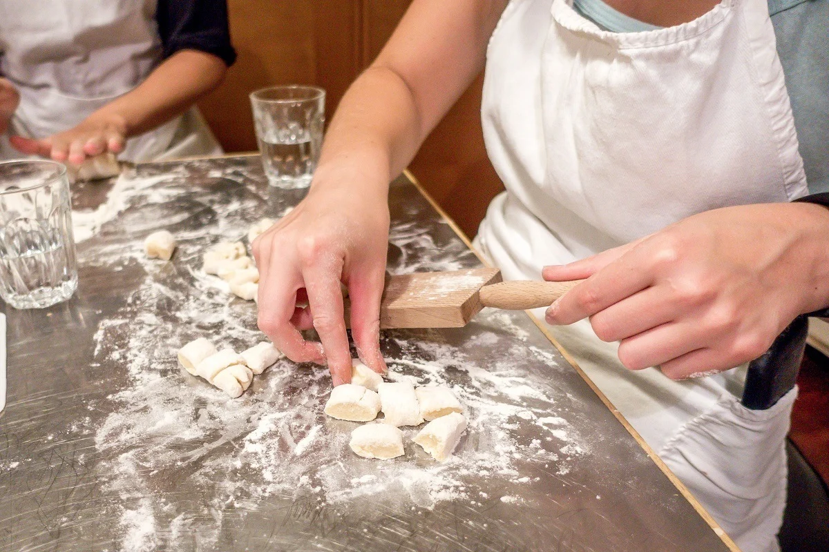 Person rolling and shaping gnocchi