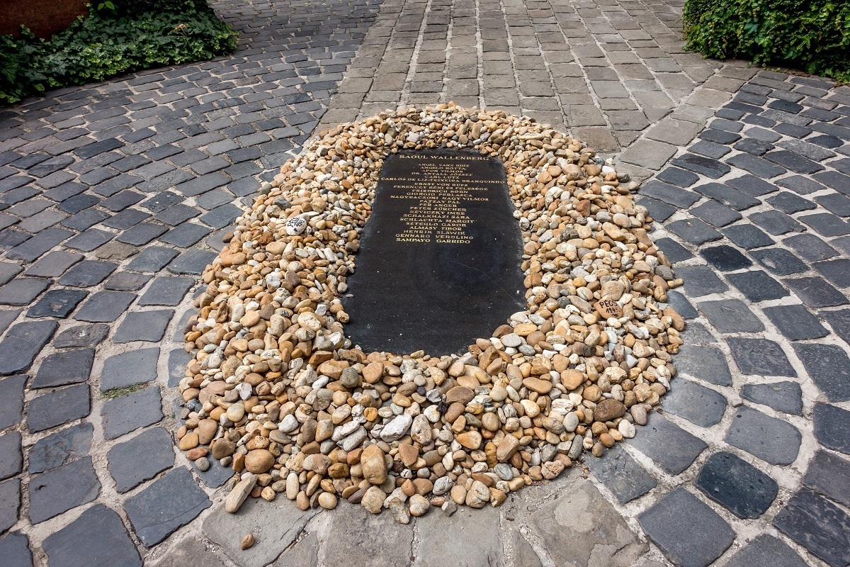 Memorial plaque surrounded by stones