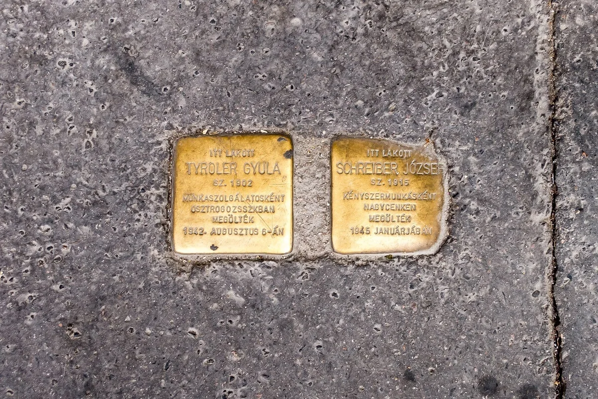 Gold memorial plaques with names and dates inscribed