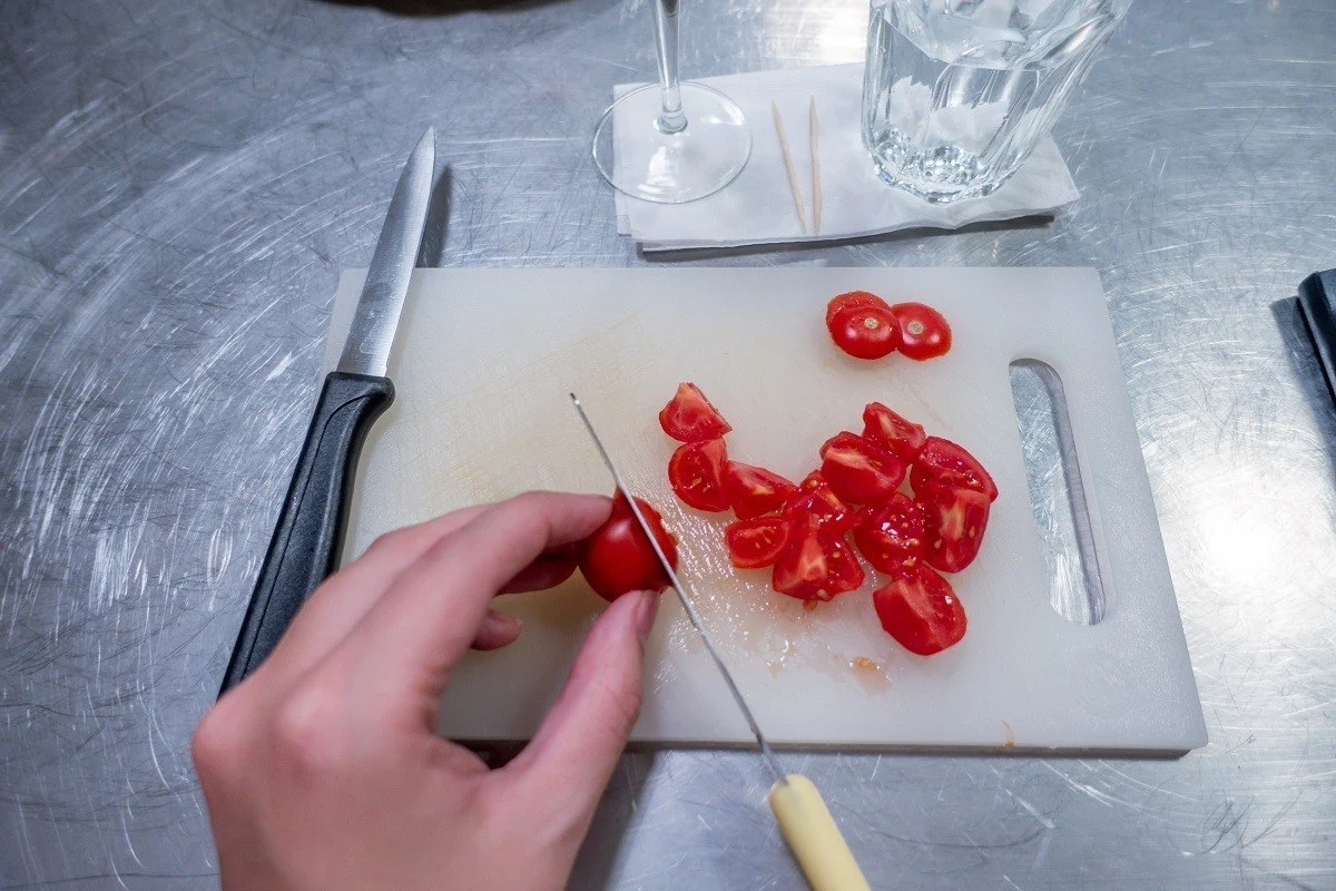 Prepping the tomatoes for the bruschetta during a Rome cooking class