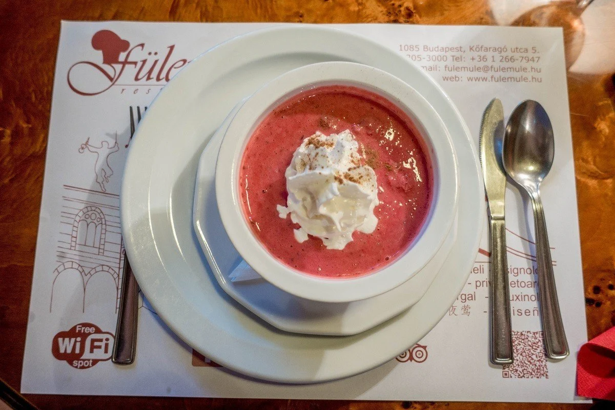 Cold fruit soup topped with whipped cream
