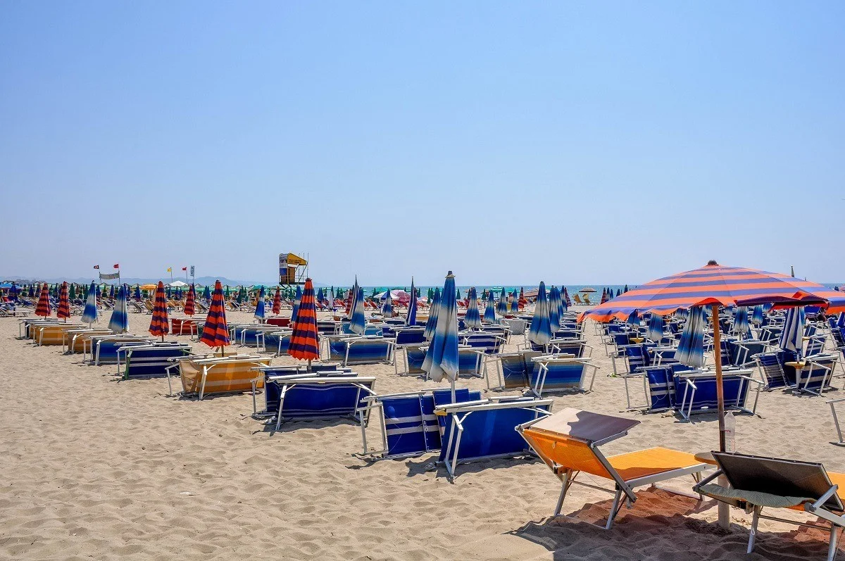 An empty beach full of beach chairs
