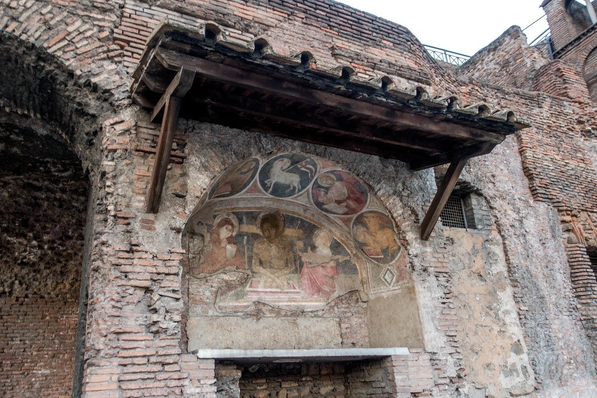 Early Christian art outside on a brick wall in Rome