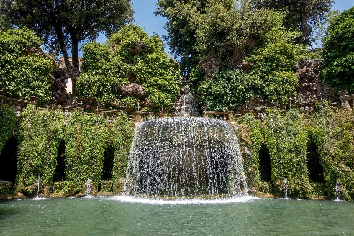 The Fountain of Tivoli is a wall of water topped with a statue among greenery