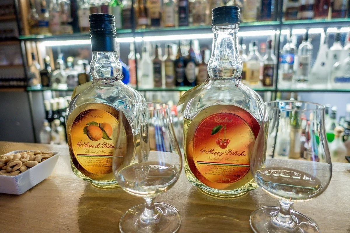 Bottles and glasses of palinka, Hungarian fruit brandy 