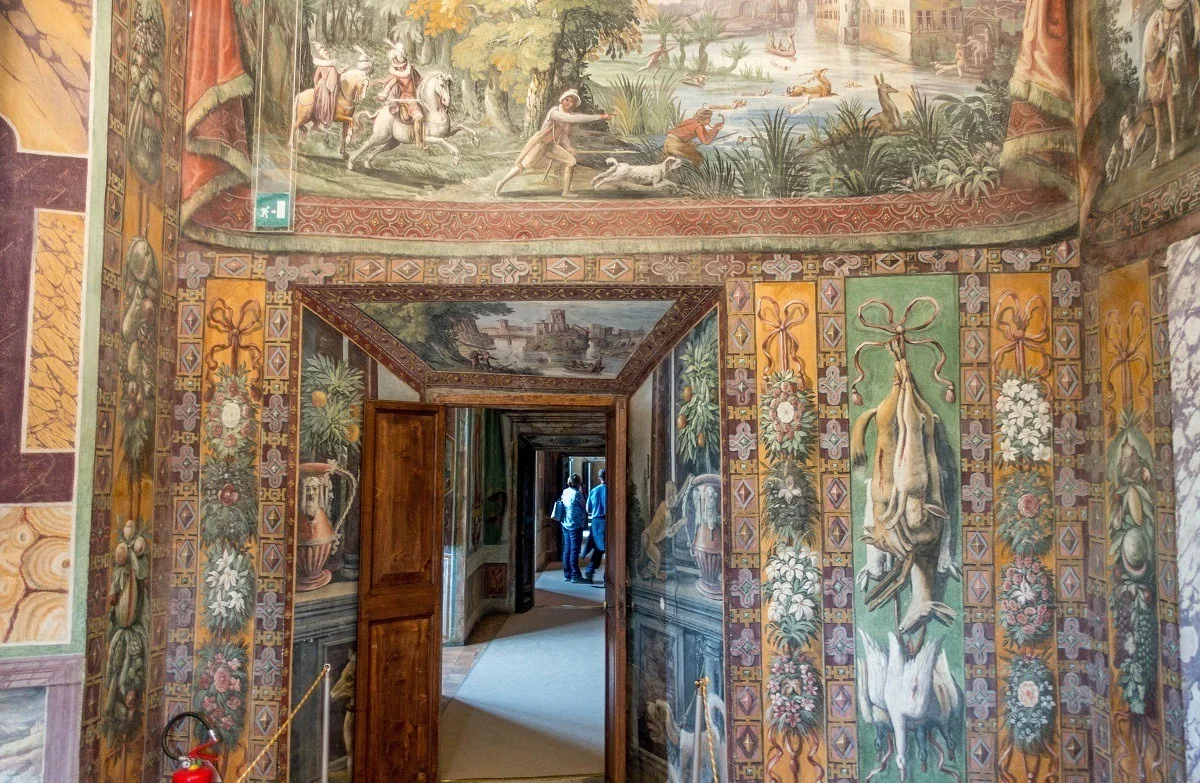 Brightly painted walls with animals and hunting scenes