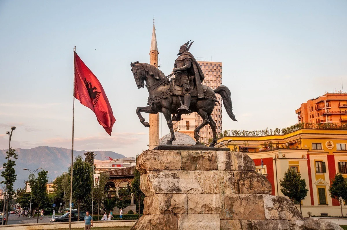 Skanderbeg statue and Albanian flag in Tirana