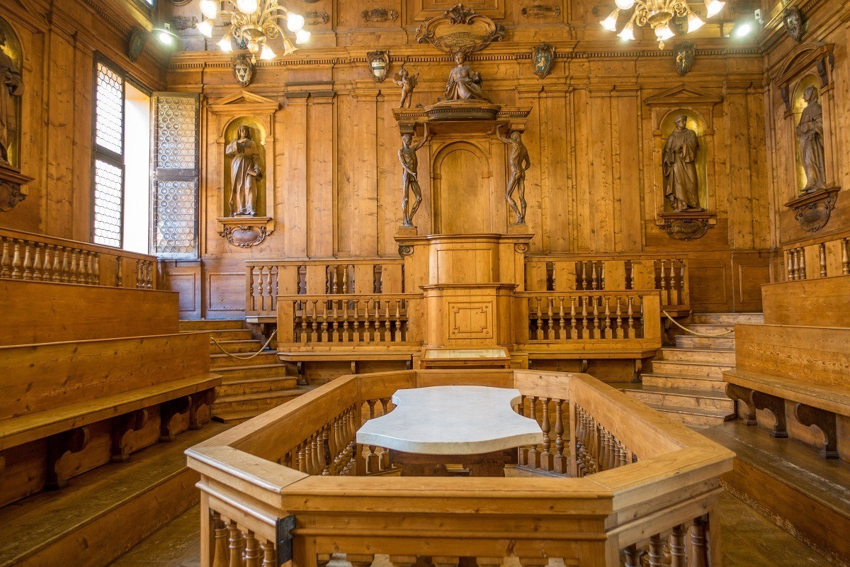 Wooden room with autopsy platform in the center.