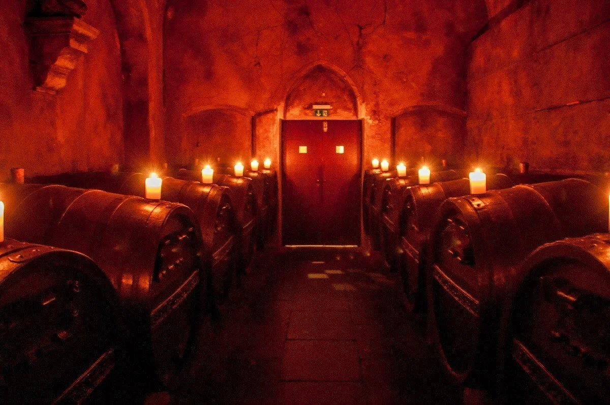 Wine barrels illuminated with candles